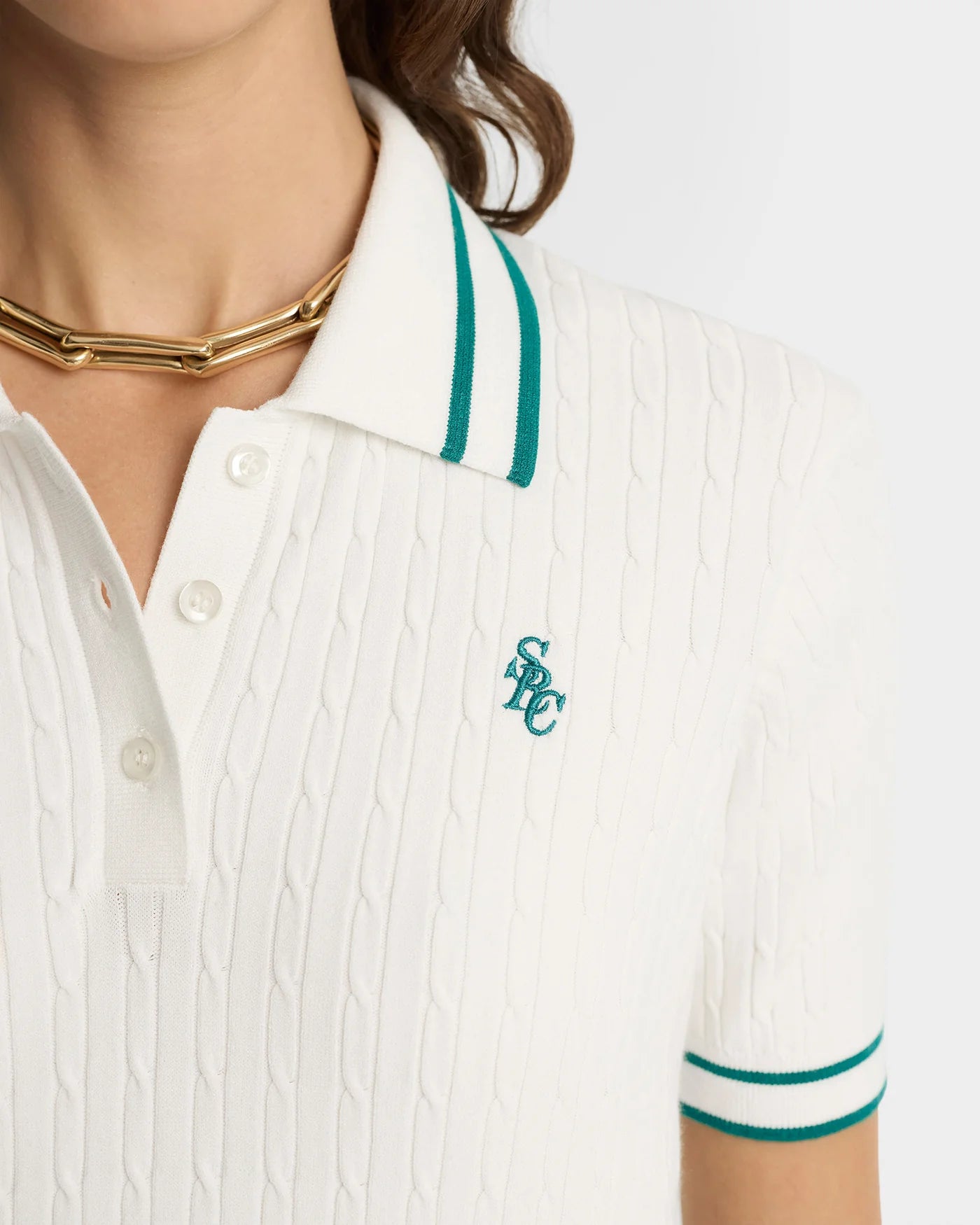 Remera polo SRC Mini Cable blanco y verde Sporty & Rich